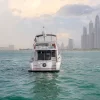 Rear view of 50 FT Al Shali yacht cruising near Dubai skyline