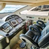 Captain’s cockpit with luxury leather seats on 90 FT Sunseeker yacht