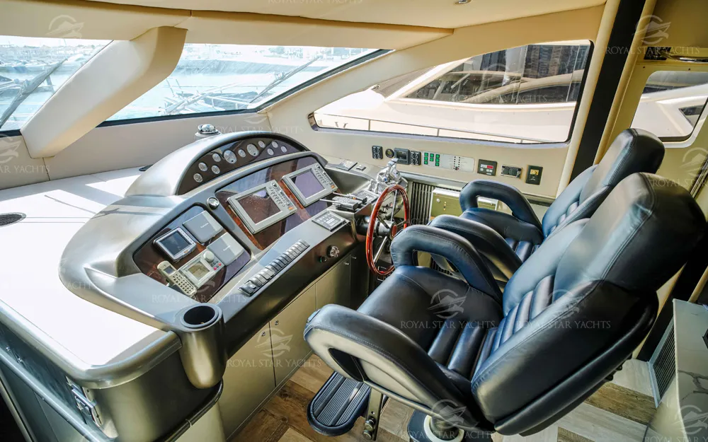 Captain’s cockpit with luxury leather seats on 90 FT Sunseeker yacht