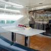 Outdoor dining area with drinks setup on 90 FT Sunseeker yacht deck