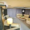 Stylish living area with curved sofas on 90 FT Sunseeker