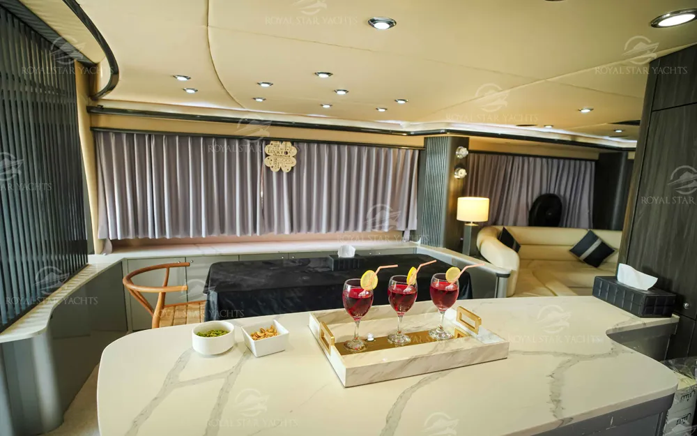 Dining table with drinks setup inside 90 FT Sunseeker yacht