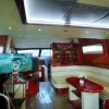 Spacious lounge with LED ceiling lights and sofa seating inside Mayyas yacht