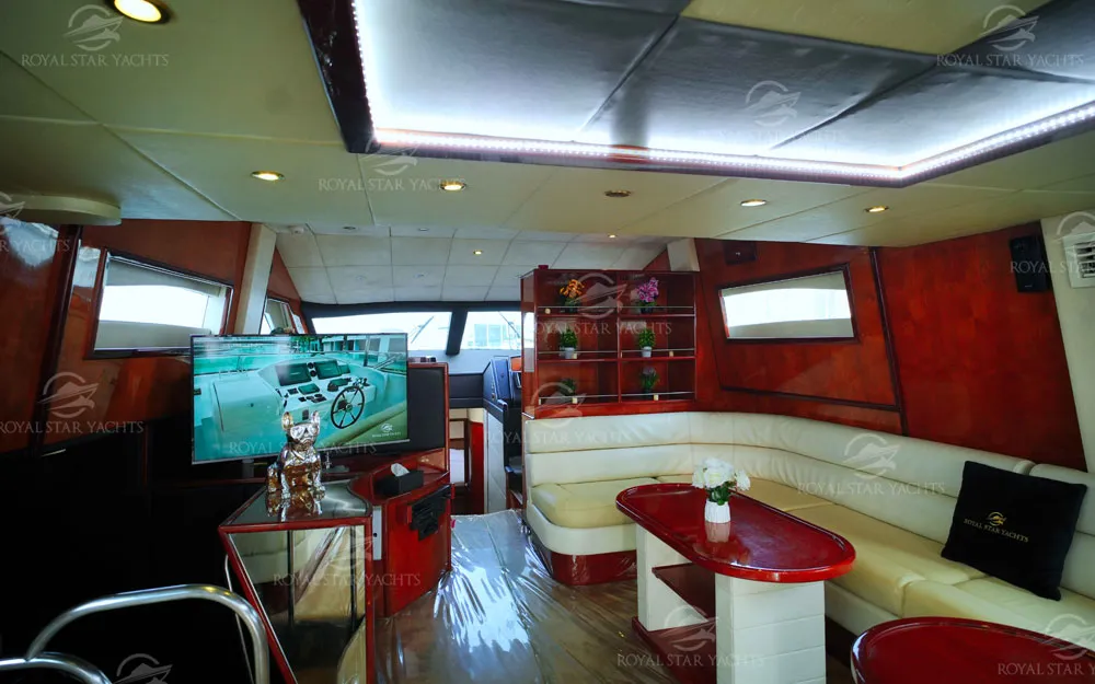 Spacious lounge with LED ceiling lights and sofa seating inside Mayyas yacht