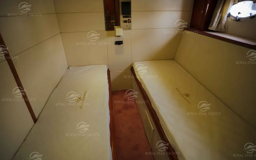 Twin cabin bedroom with two single beds inside 75 FT Mayyas yacht
