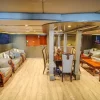 Spacious yacht interior with dining and lounge area