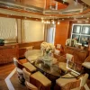 Elegant dining area with wooden finish inside 101 FT Majesty yacht