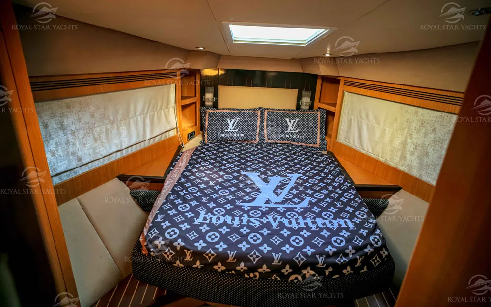Bedroom with luxury bedding inside 59 FT Majesty yacht