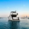 68 FT Luna yacht sailing near Dubai Marina skyline.