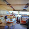 Indoor seating and dining area on 68 FT Luna yacht.